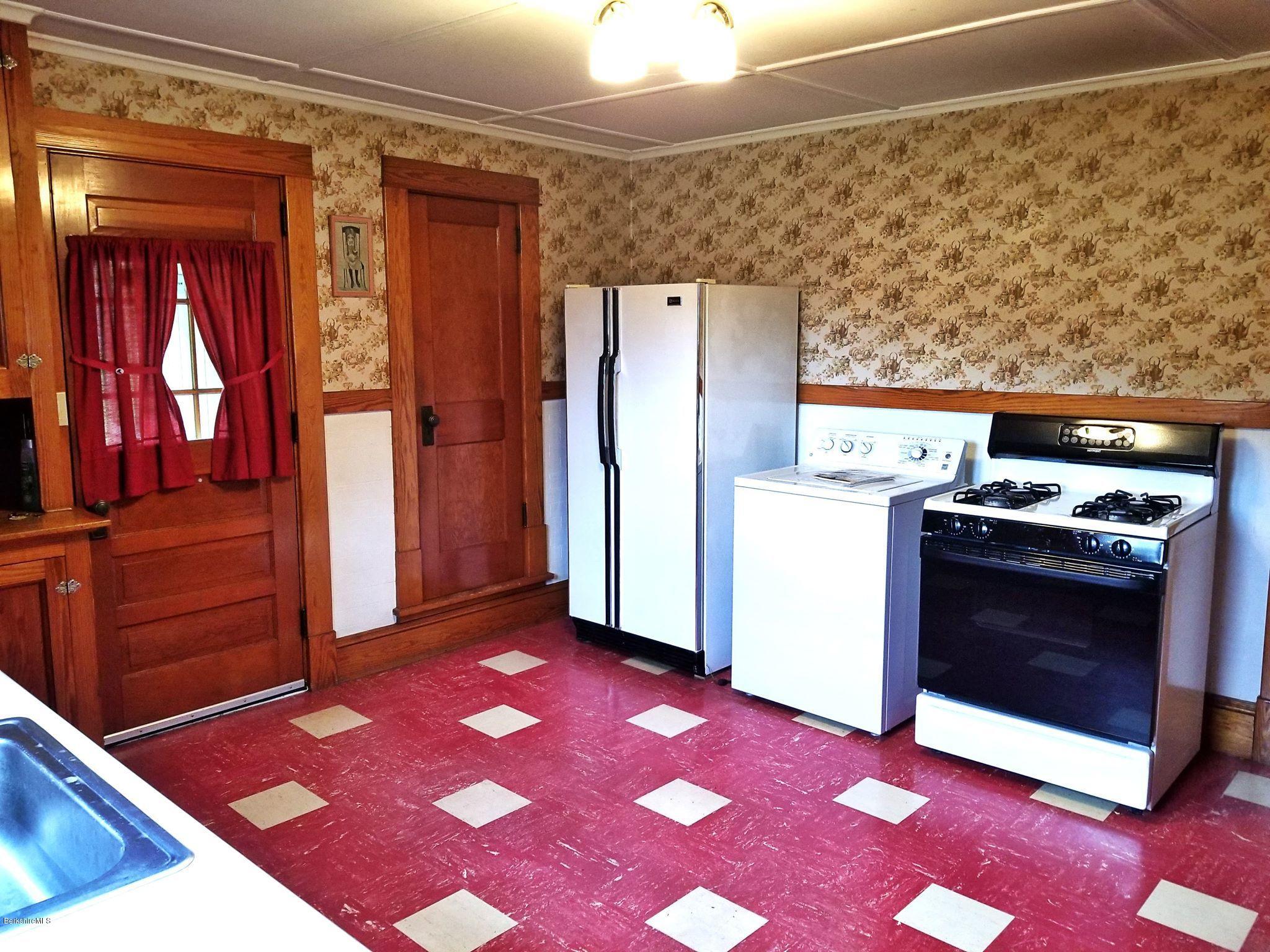 213 East Road Adams, MA 01220 - Photo 8 of 21 a kitchen with a stove a refrigerator and a stove