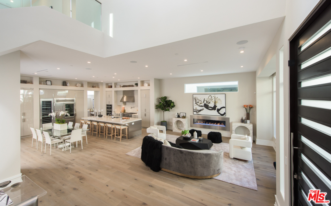 a living room with furniture and white walls