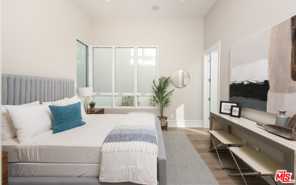 5918 Firefly Place Playa Vista, CA 90094 - Photo 14 of 34 a bedroom with a bed lamps and couches