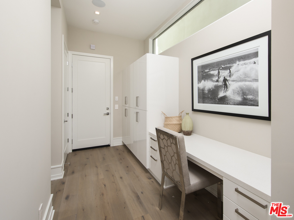 5918 Firefly Place Playa Vista, CA 90094 - Photo 16 of 34 a hallway with a wooden floor and a workspace