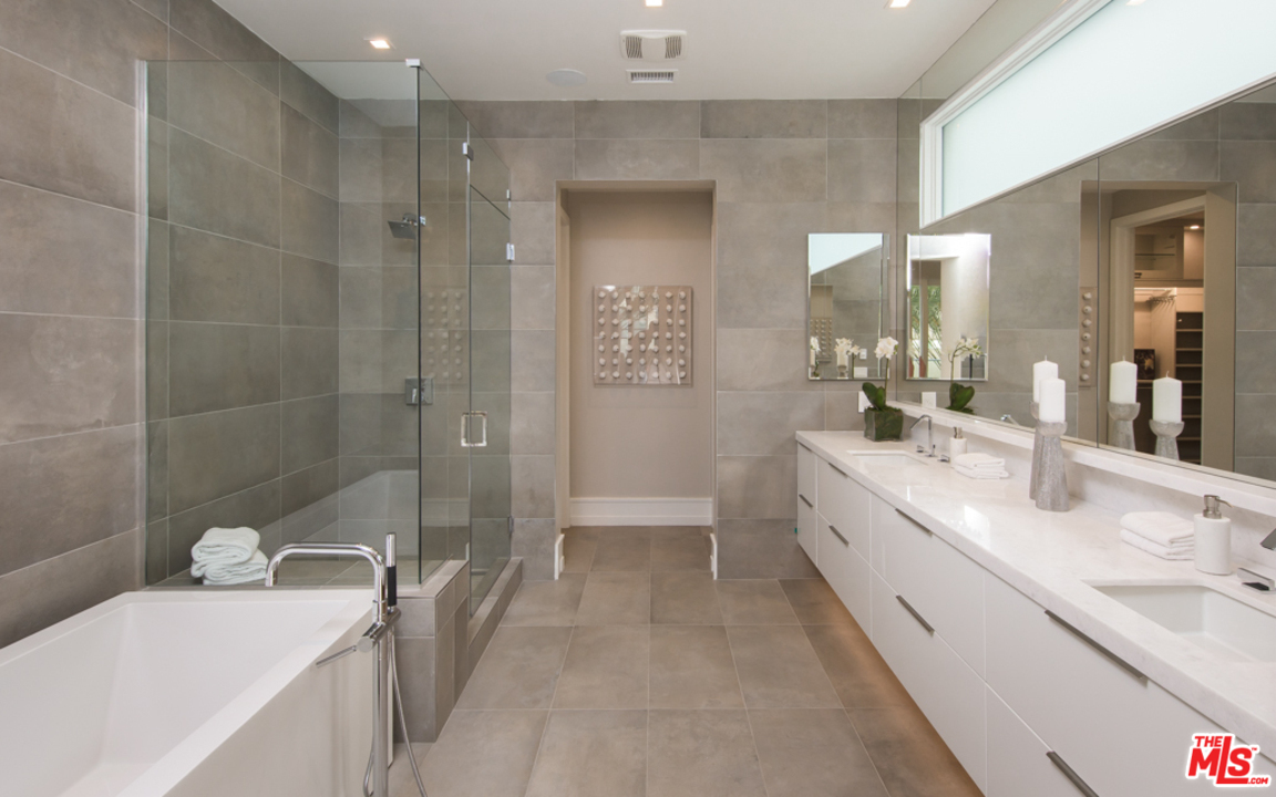 5918 Firefly Place Playa Vista, CA 90094 - Photo 20 of 34 a bathroom with a double vanity sink toilet and shower