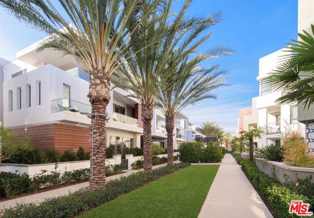 5918 Firefly Place Playa Vista, CA 90094 - Photo 2 of 34 a front view of a house with a yard and trees