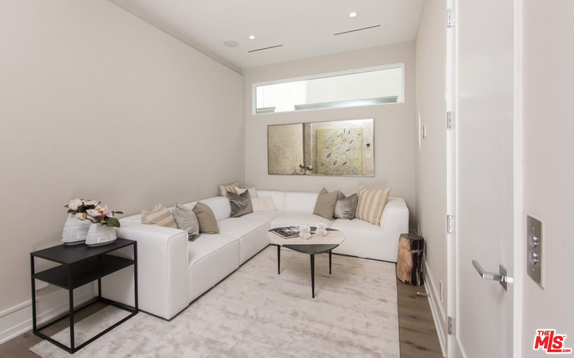 5918 Firefly Place Playa Vista, CA 90094 - Photo 23 of 34 a living room with furniture and a painting on the wall
