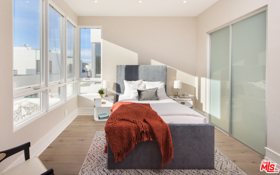 5918 Firefly Place Playa Vista, CA 90094 - Photo 27 of 34 a bedroom with a large bed and a large window