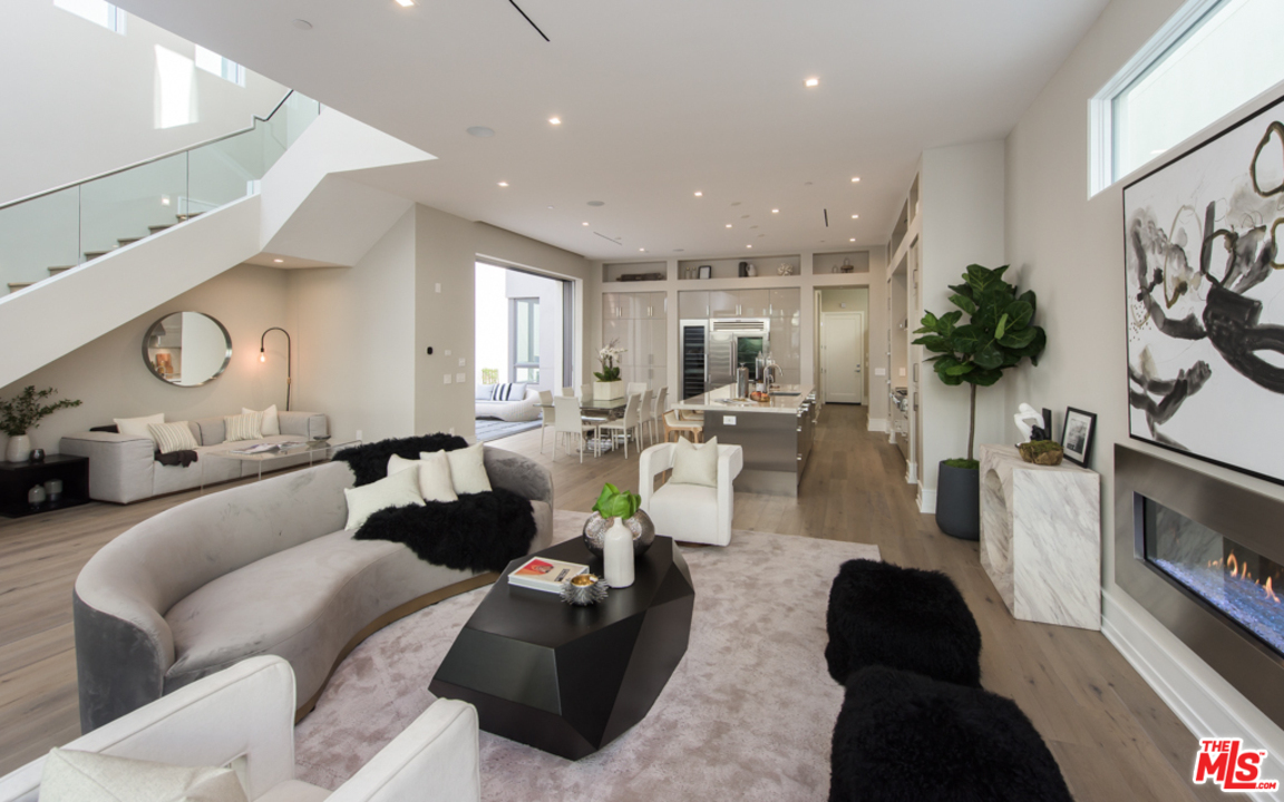 5918 Firefly Place Playa Vista, CA 90094 - Photo 4 of 34 a living room with furniture and a flat screen tv