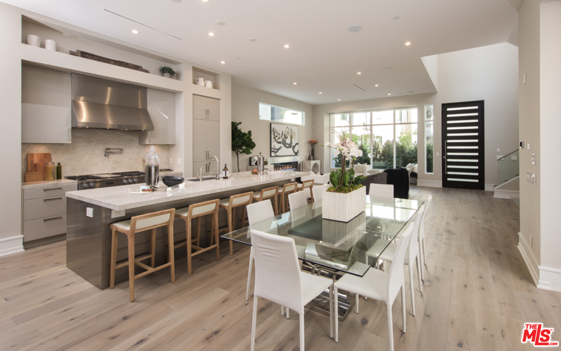 5918 Firefly Place Playa Vista, CA 90094 - Photo 8 of 34 a large kitchen with a table and chairs