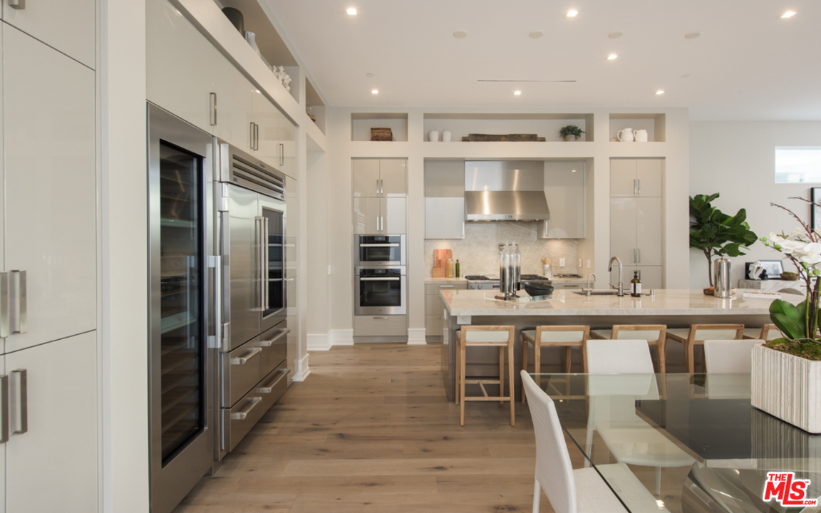 5918 Firefly Place Playa Vista, CA 90094 - Photo 9 of 34 a kitchen with stainless steel appliances granite countertop a refrigerator and a stove top oven