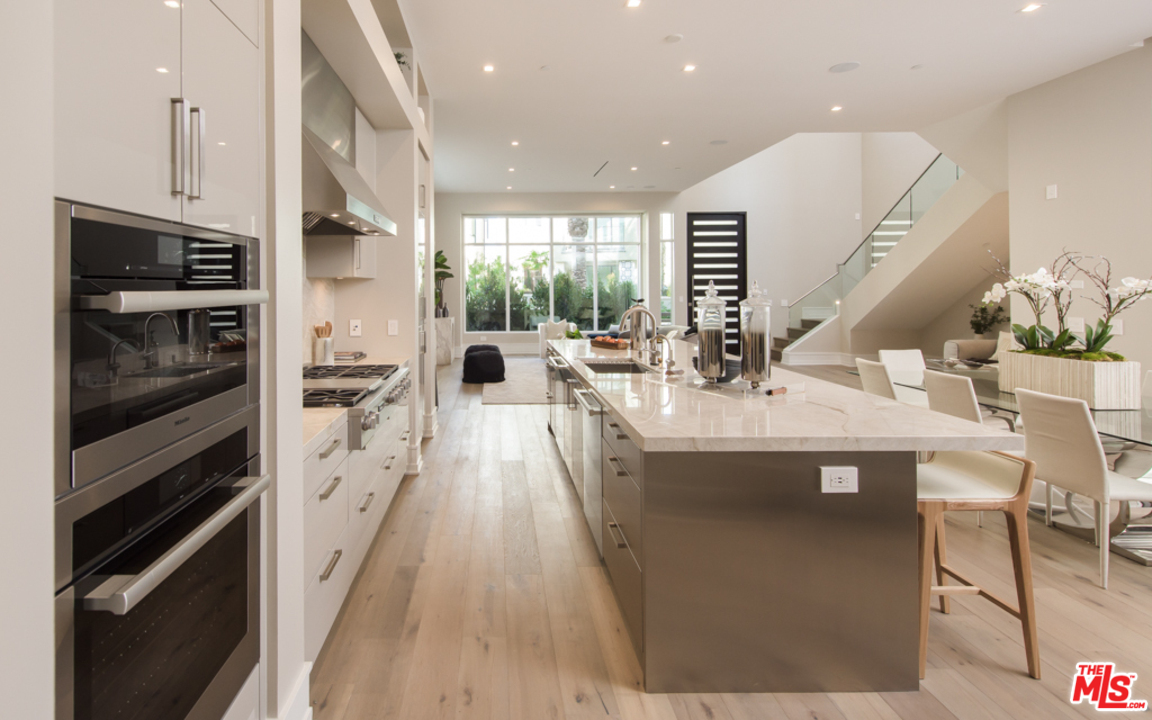 5918 Firefly Place Playa Vista, CA 90094 - Photo 10 of 34 a kitchen with stainless steel appliances a sink stove and cabinets