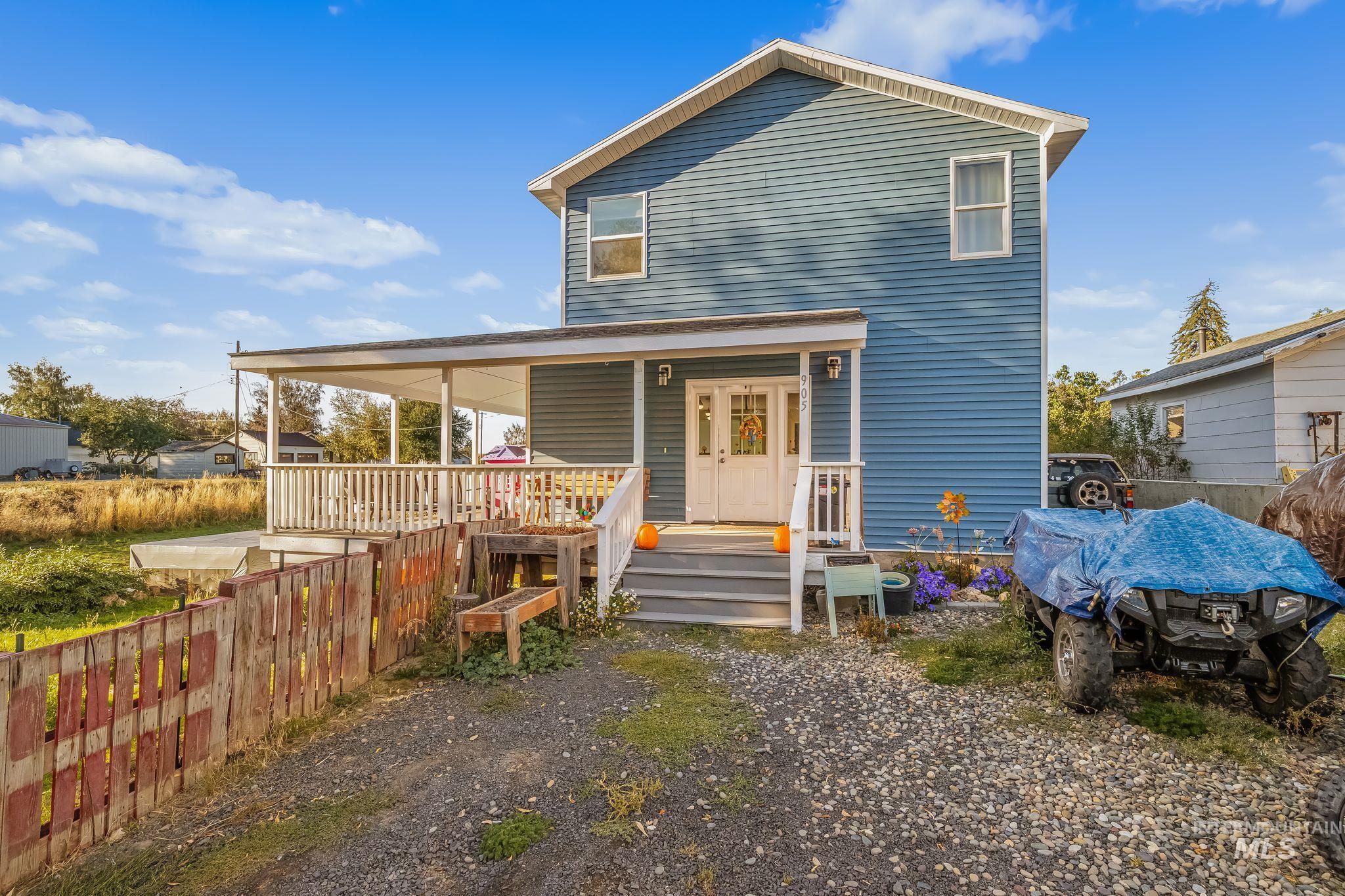 Two-story residence with blue siding and white trim