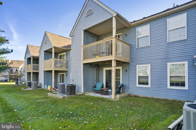 a view of a brick house with a yard