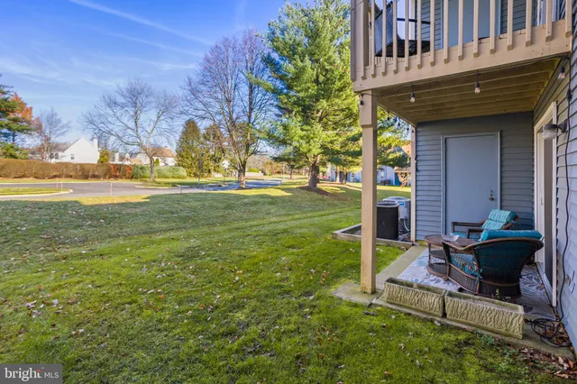 a view of a house with backyard porch and sitting area