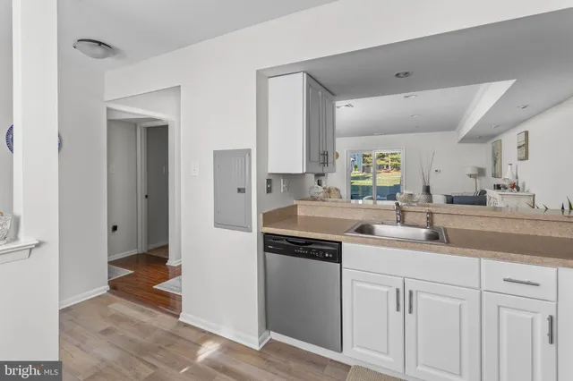 a kitchen with a sink dishwasher a stove and a refrigerator