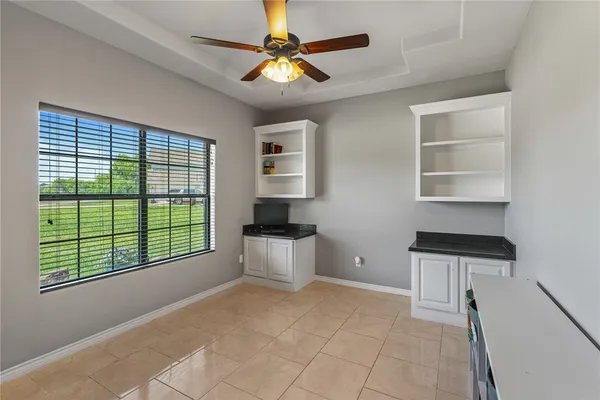 a kitchen that has a sink a stove and a window