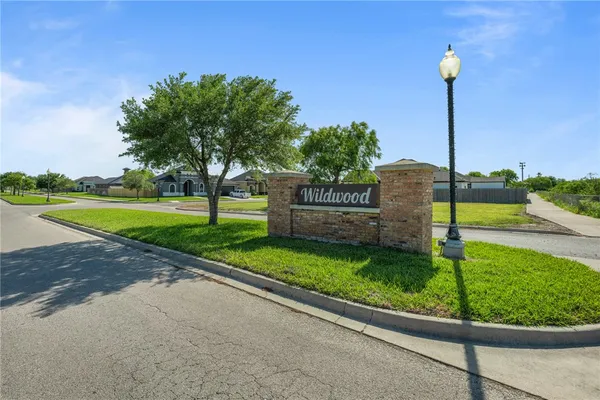 a view of a park with a sign board