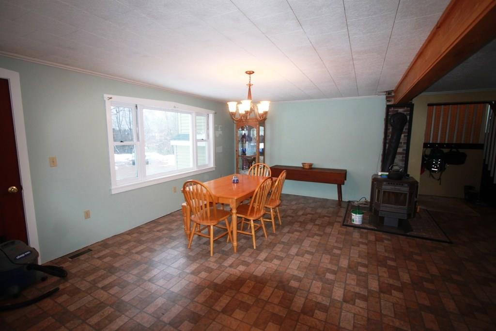 1430 Bangor Road Dover-Foxcroft, ME 04426 - Photo 17 of 25 Dining area with pellet stove