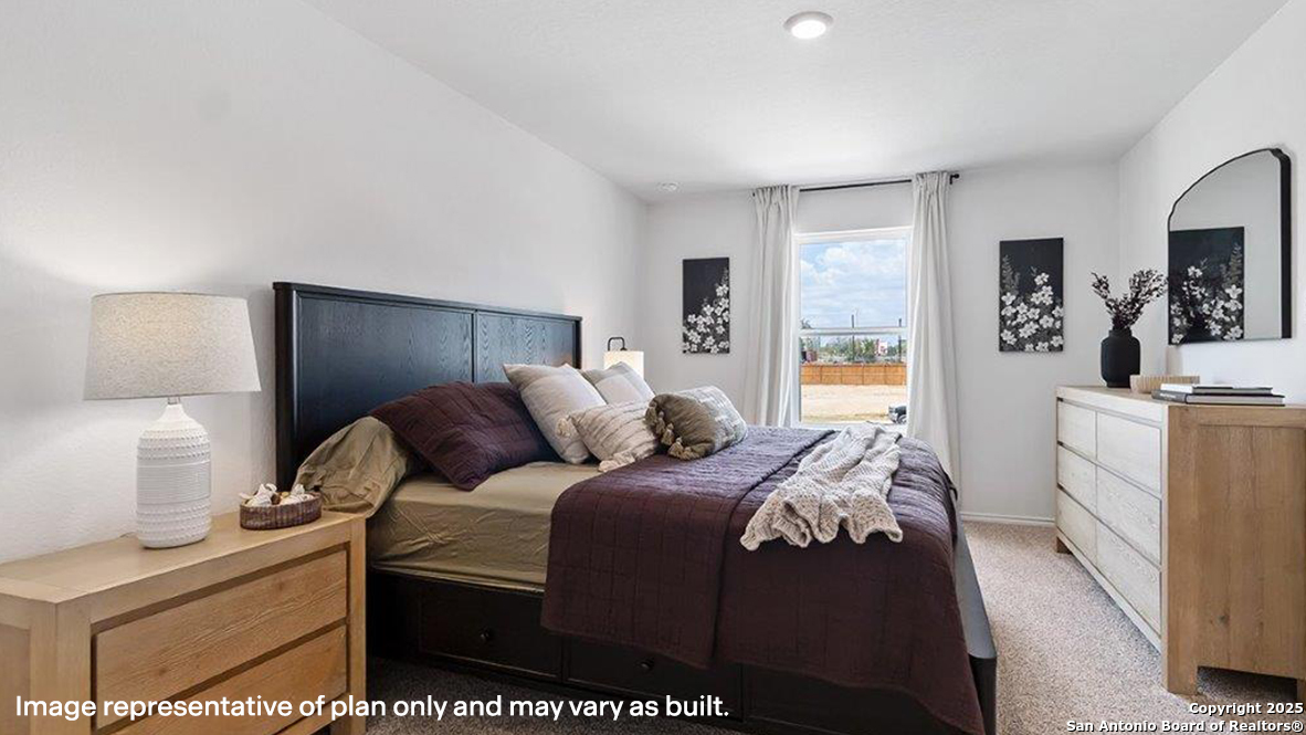 4903 Jackrabbit Converse, TX 78109 - Photo 21 of 49 a bedroom with a bed and a couch