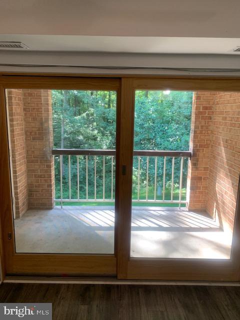 5829 Cove Landing Road, Unit 202 Burke, VA 22015 - Photo 8 of 27 Doors to large balcony overlooks woods!