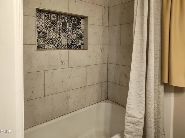 a bathroom with a bathtub