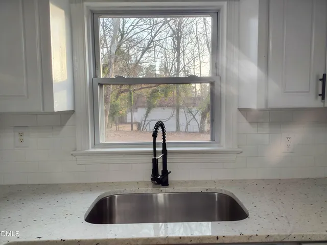 a view with a sink and a window