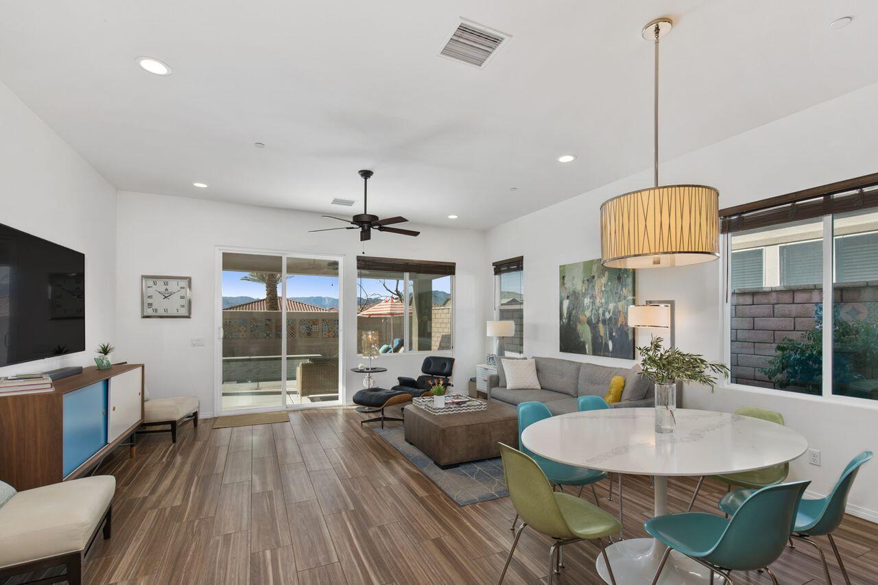 85559 Treviso Drive Indio, CA 92203 - Photo 13 of 30 a living room with furniture a flat screen tv and a large window