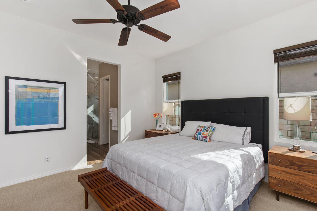 85559 Treviso Drive Indio, CA 92203 - Photo 14 of 30 a bedroom with a bed and a painting on the wall