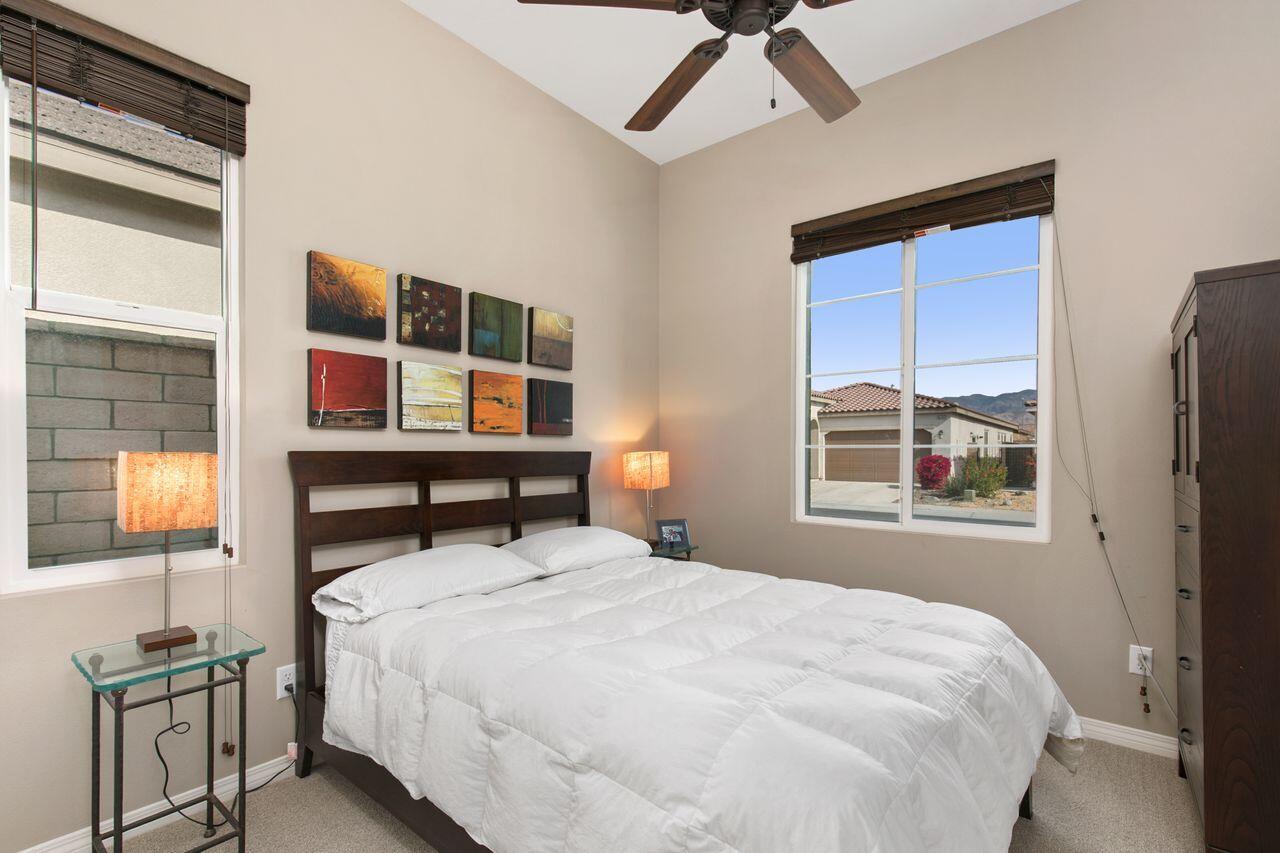 85559 Treviso Drive Indio, CA 92203 - Photo 18 of 30 a bedroom with a bed and a window