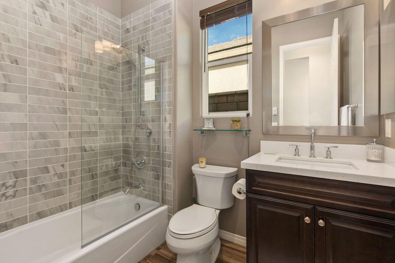 85559 Treviso Drive Indio, CA 92203 - Photo 19 of 30 a bathroom with a sink a toilet and shower