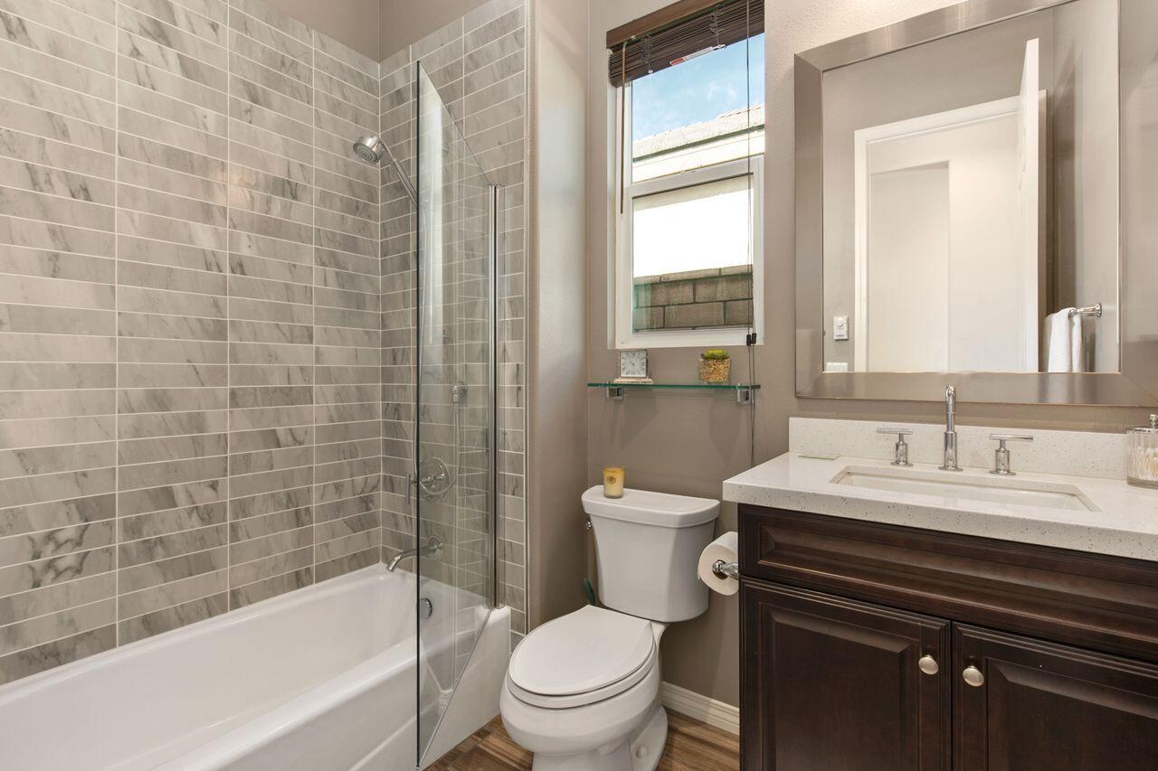 85559 Treviso Drive Indio, CA 92203 - Photo 20 of 30 a bathroom with a sink a toilet and shower