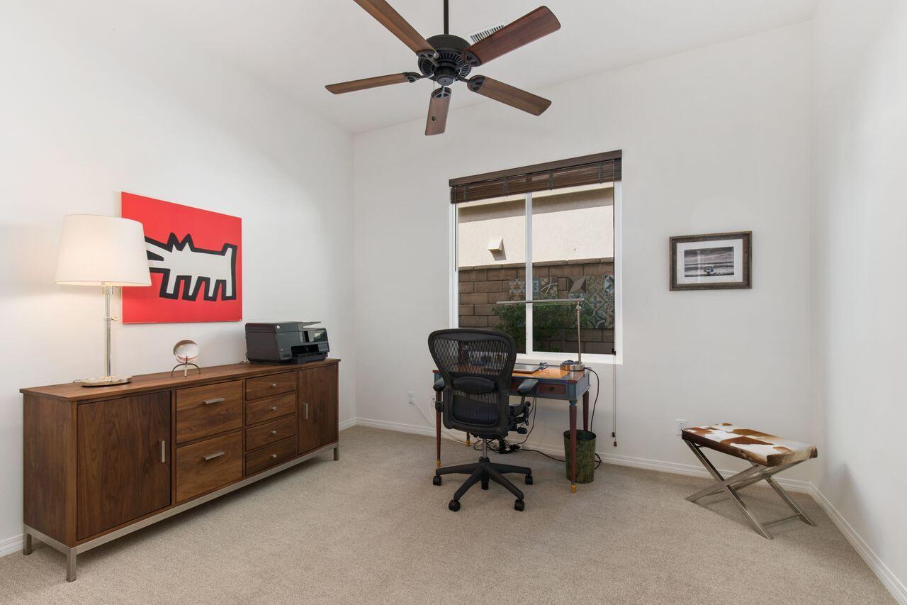 85559 Treviso Drive Indio, CA 92203 - Photo 21 of 30 a view of a workspace with furniture and a window