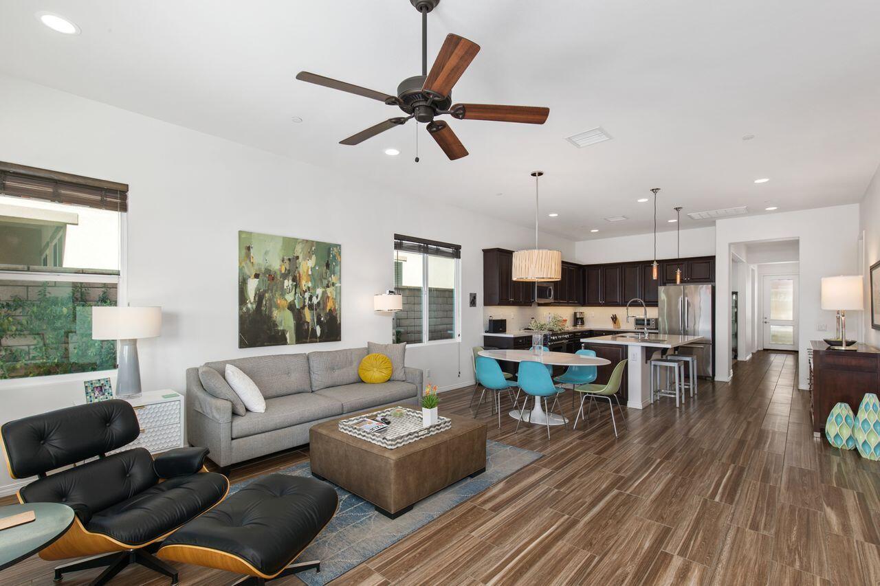 85559 Treviso Drive Indio, CA 92203 - Photo 10 of 30 a living room with lots of furniture kitchen view and a wooden floor