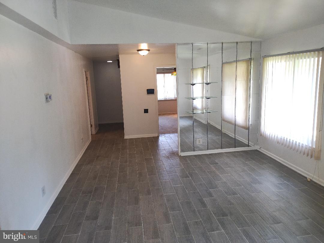 2841 Aquarius Avenue Silver Spring, MD 20906 - Photo 13 of 57 an empty room with wooden floor and windows