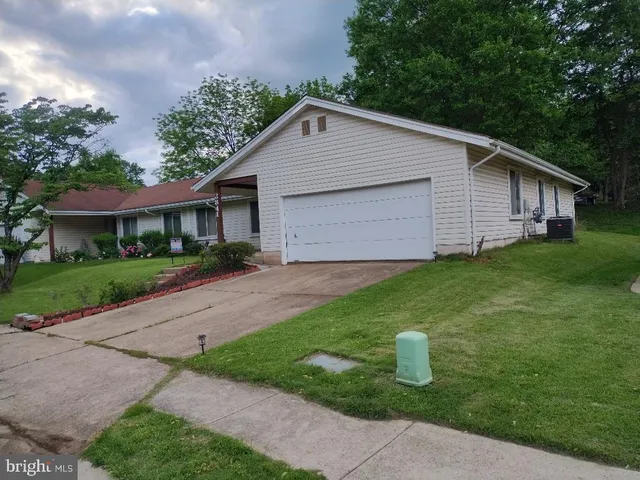 a view of a yard in front view of a house