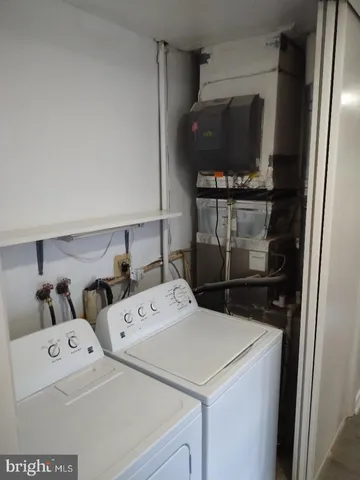 a bathroom with a sink toilet and mirror