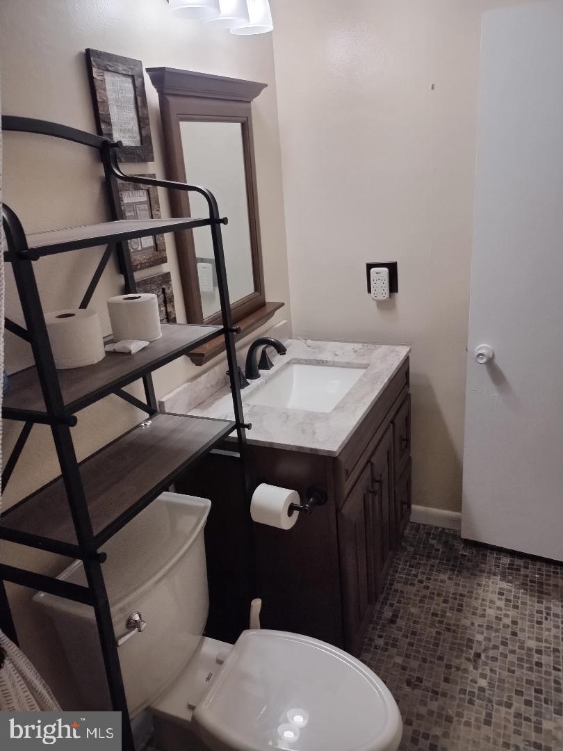 2841 Aquarius Avenue Silver Spring, MD 20906 - Photo 40 of 57 a bathroom with a sink toilet and mirror