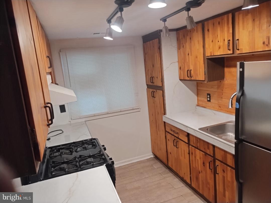 2841 Aquarius Avenue Silver Spring, MD 20906 - Photo 5 of 57 a kitchen with stainless steel appliances a refrigerator and a stove