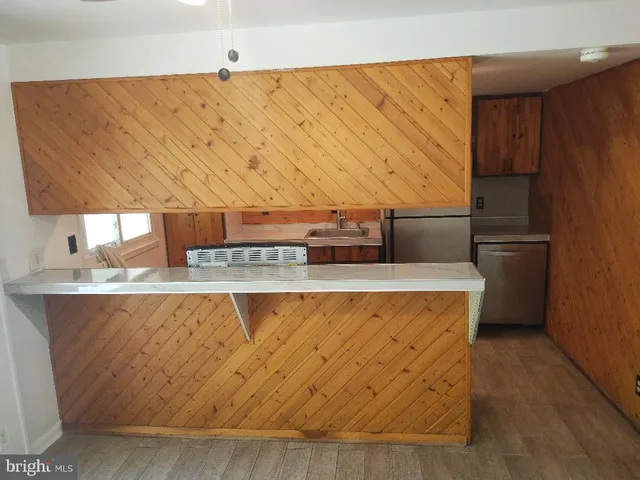 a kitchen with a sink stove and microwave