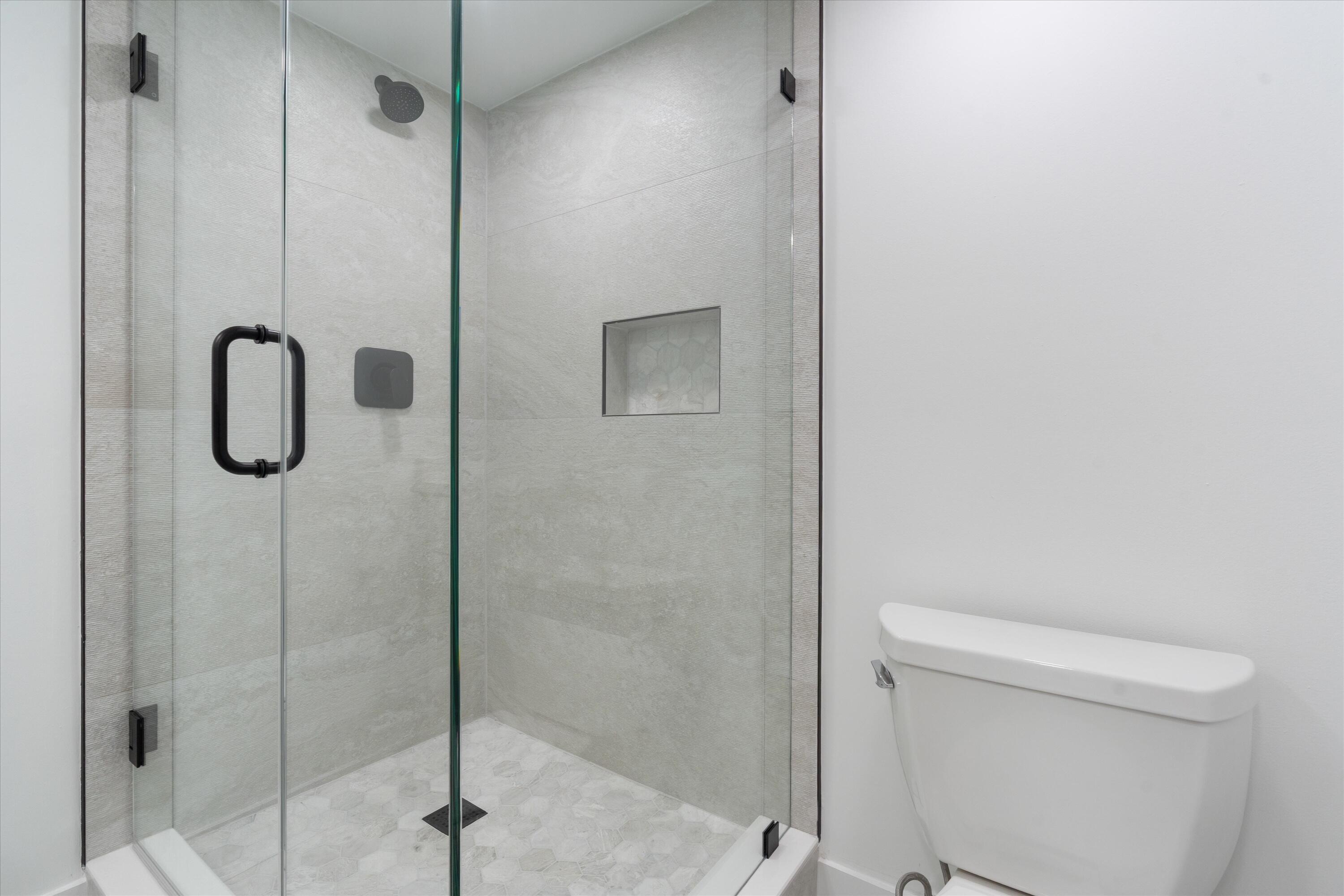 2897 Southwest 22nd Circle, Unit 44B Delray Beach, FL 33445 - Photo 17 of 31 a bathroom that has a shower