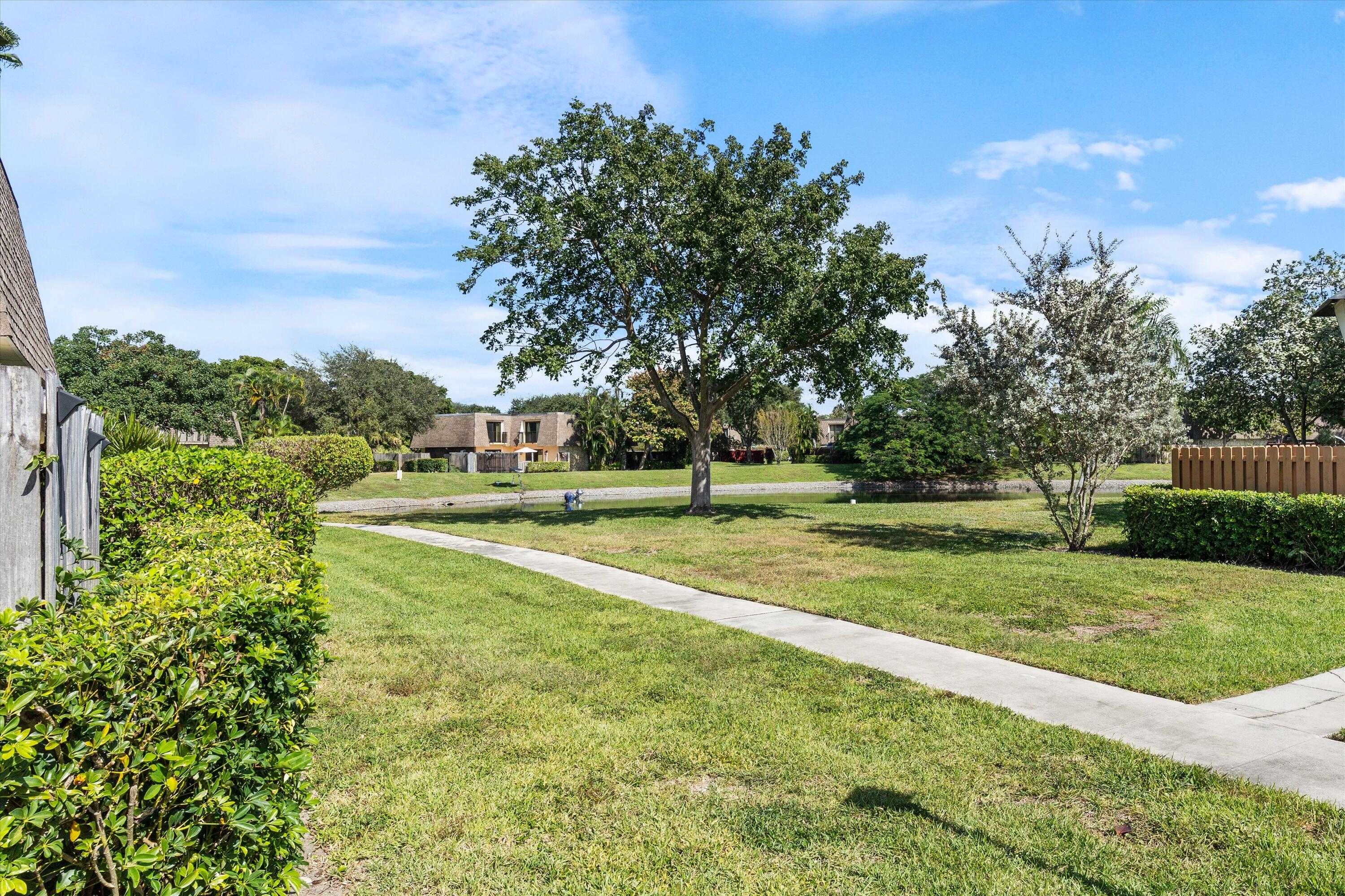 2897 Southwest 22nd Circle, Unit 44B Delray Beach, FL 33445 - Photo 23 of 31 a view of a playground with basketball court