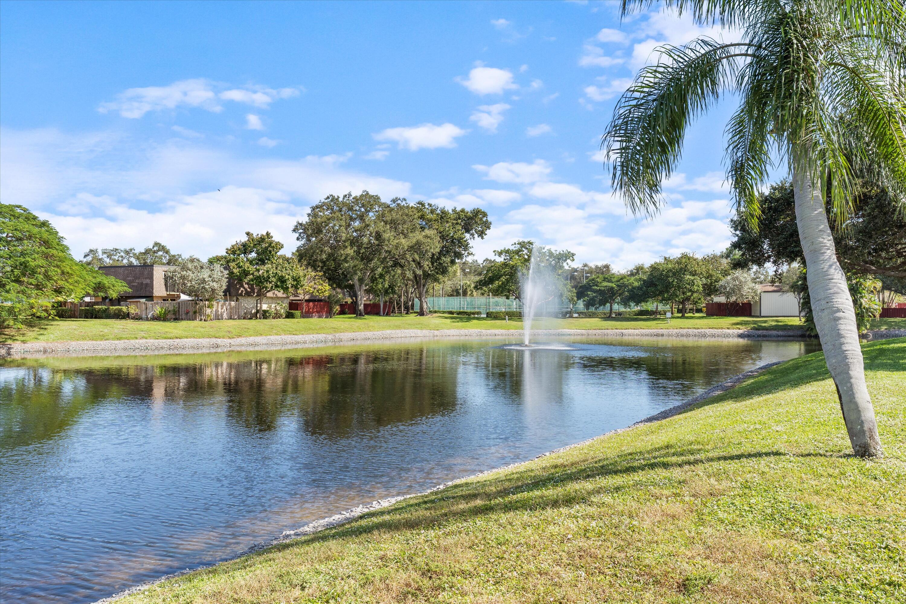 2897 Southwest 22nd Circle, Unit 44B Delray Beach, FL 33445 - Photo 24 of 31 a view of a lake with a big yard