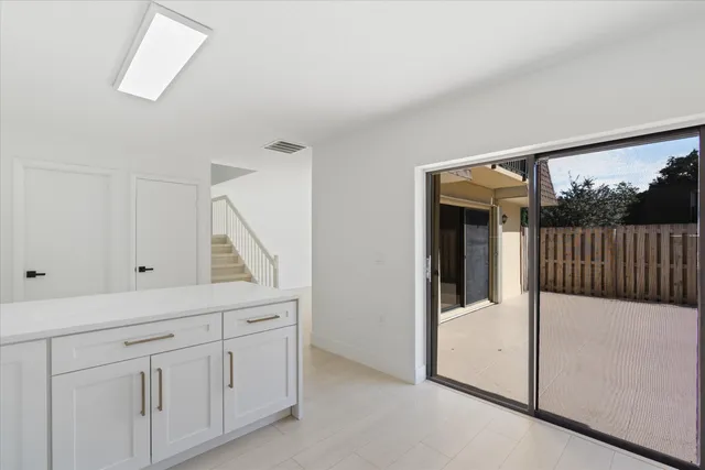a view of a hallway to a bedroom and with furniture