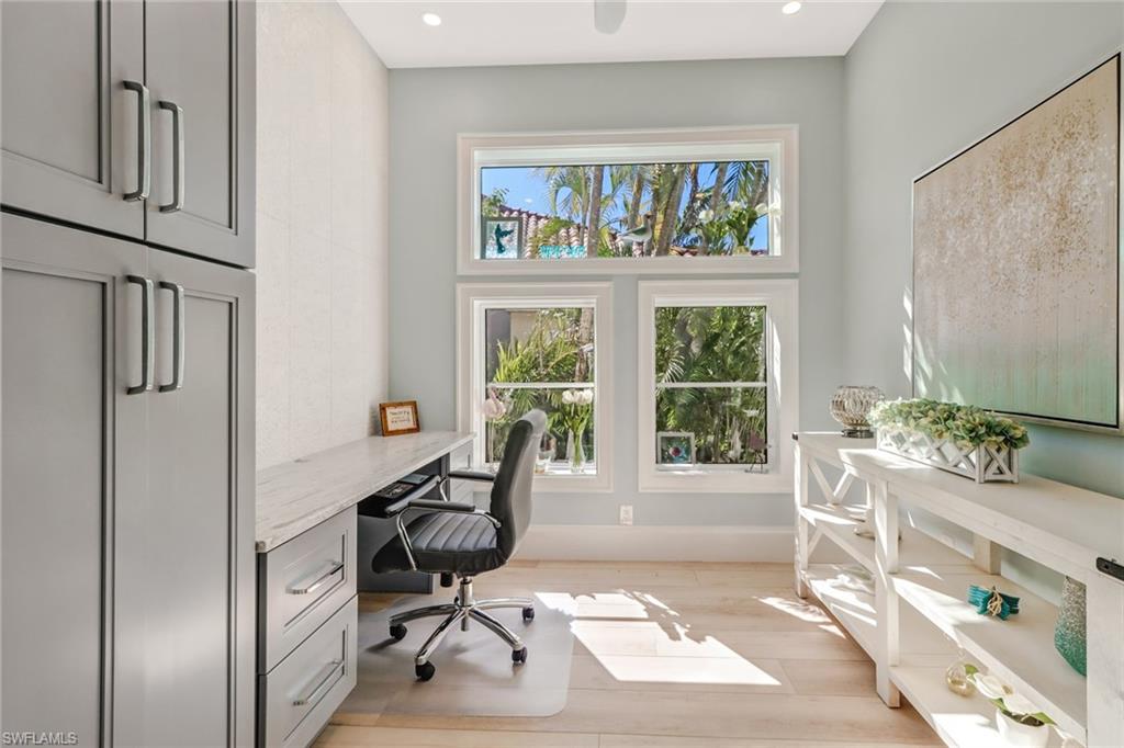 5130 Alpha Court Naples, FL 34105 - Photo 16 of 35 a view of a workspace with furniture and a window