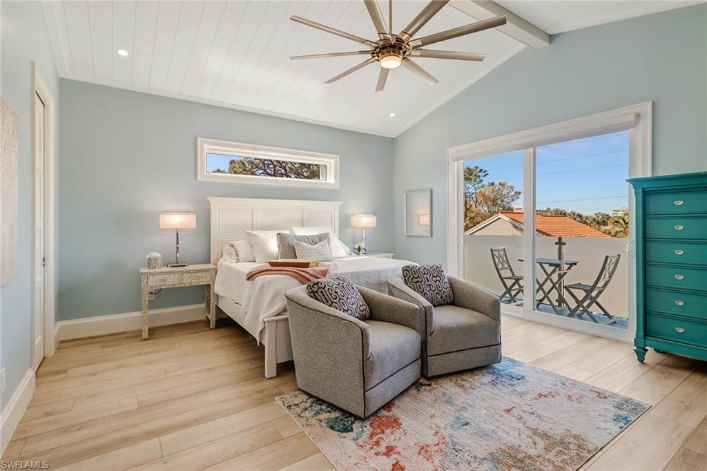 5130 Alpha Court Naples, FL 34105 - Photo 22 of 35 a bedroom with furniture and wooden floor