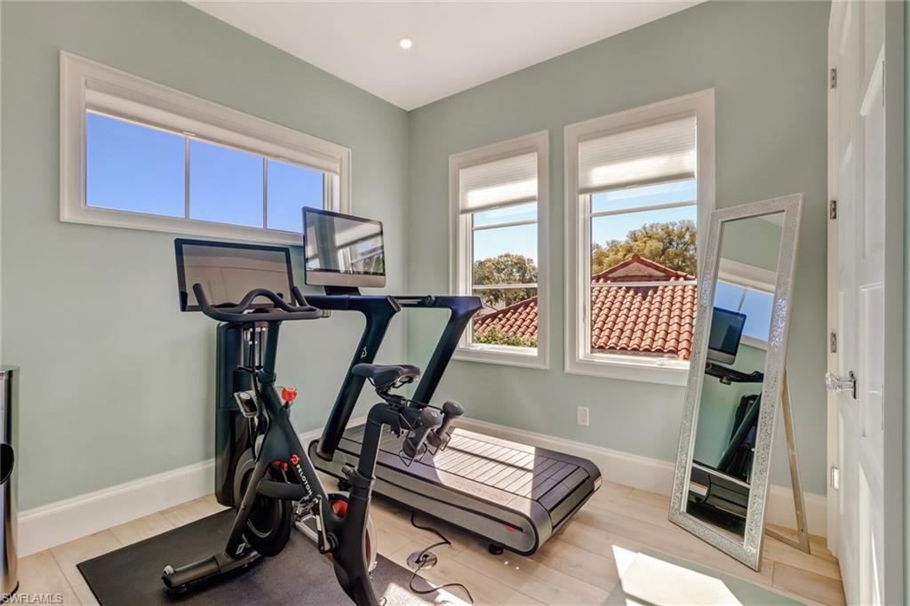 5130 Alpha Court Naples, FL 34105 - Photo 27 of 35 a view of a room with gym equipment