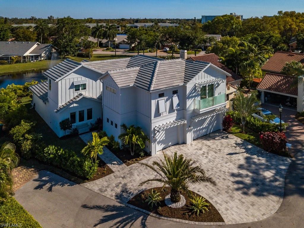 5130 Alpha Court Naples, FL 34105 - Photo 31 of 35 an aerial view of a house with a garden