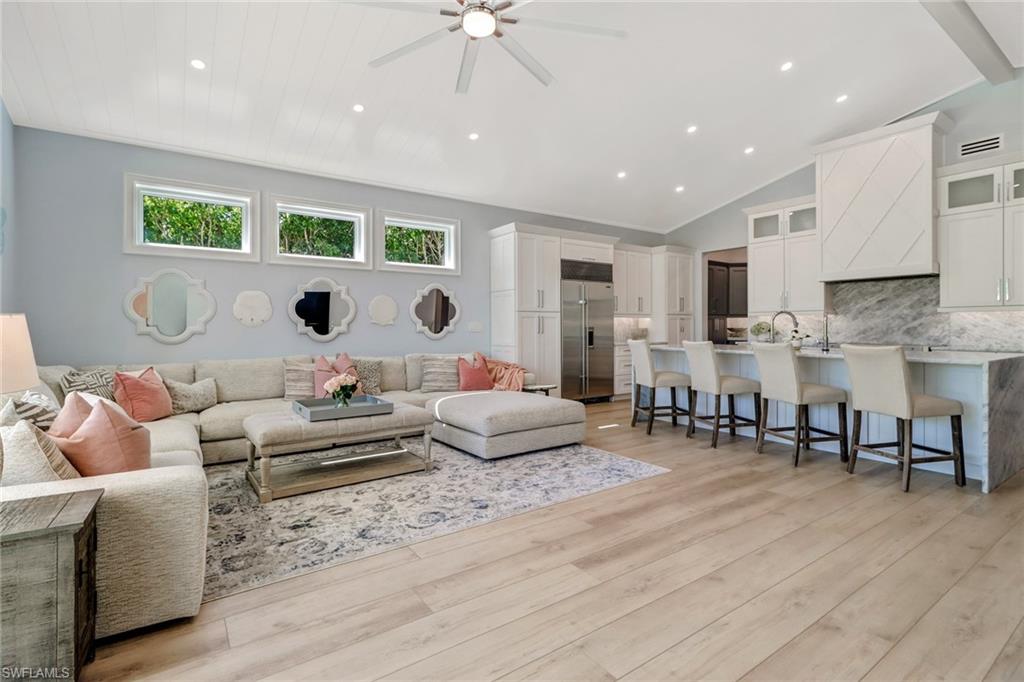 5130 Alpha Court Naples, FL 34105 - Photo 8 of 35 a living room with furniture and a large window