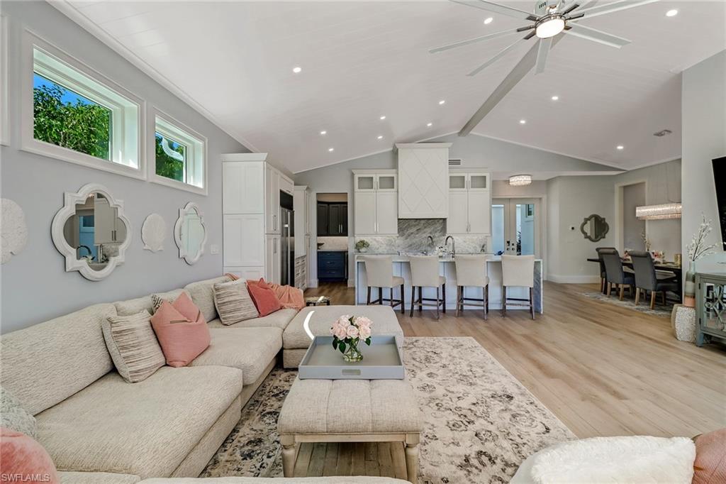 5130 Alpha Court Naples, FL 34105 - Photo 9 of 35 a living room with furniture and kitchen view