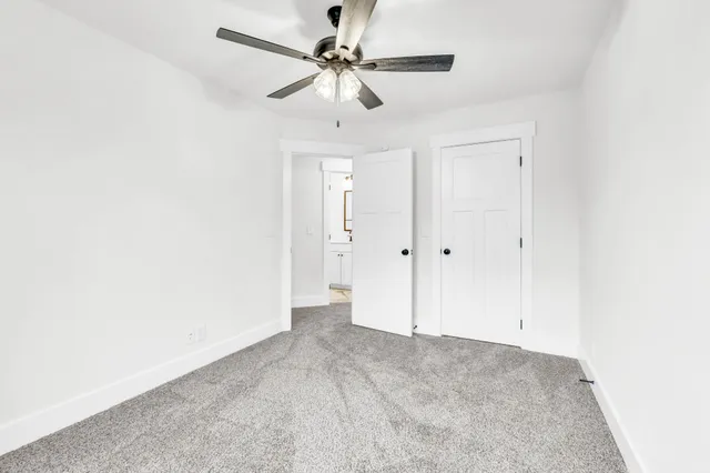 an empty room with fan