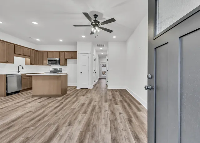 a view of kitchen with wooden floor and window