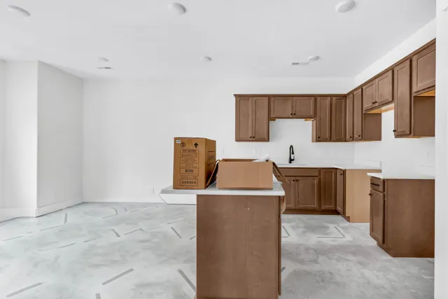a utility room with sink dryer and washer