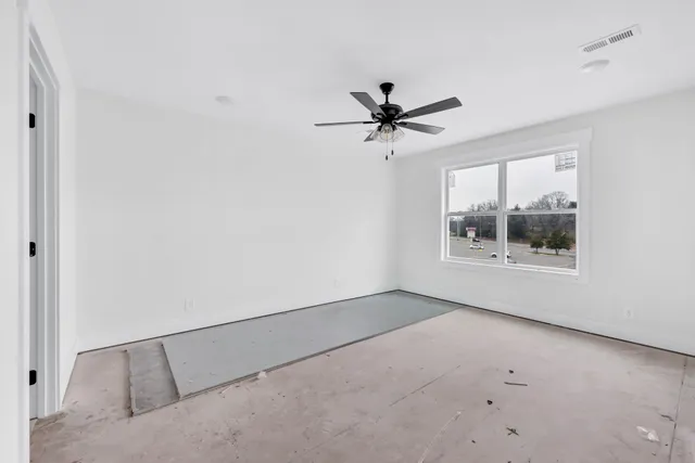 a view of an empty room with a window